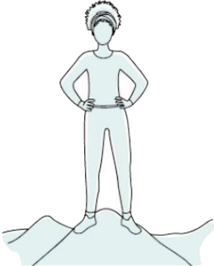 Woman standing on top of a mountain with her hands on her hips
